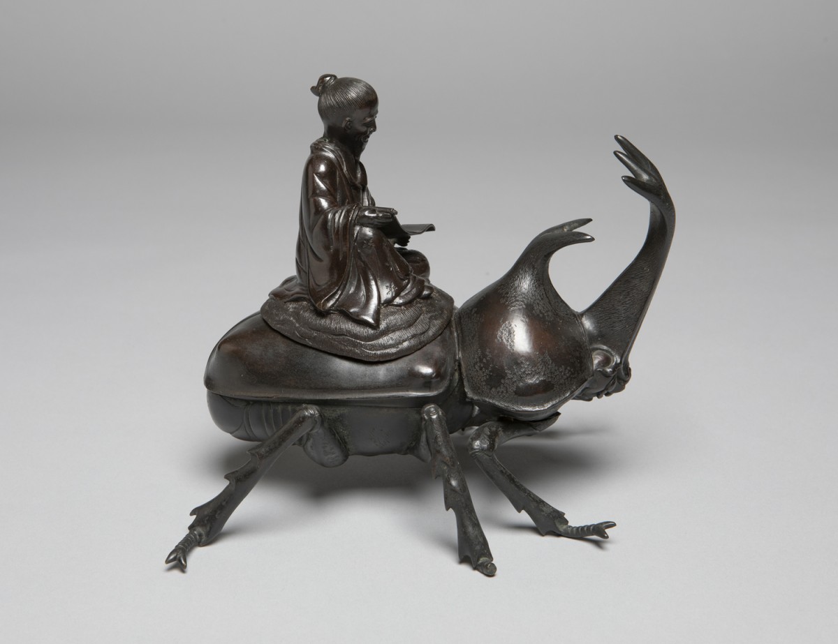 Okimono of a Chinese Sage or the Deity Jurojin Riding a Rhinoceros Beetle