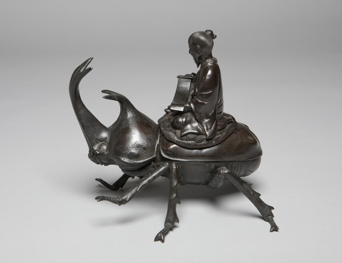 Okimono of a Chinese Sage or the Deity Jurojin Riding a Rhinoceros Beetle