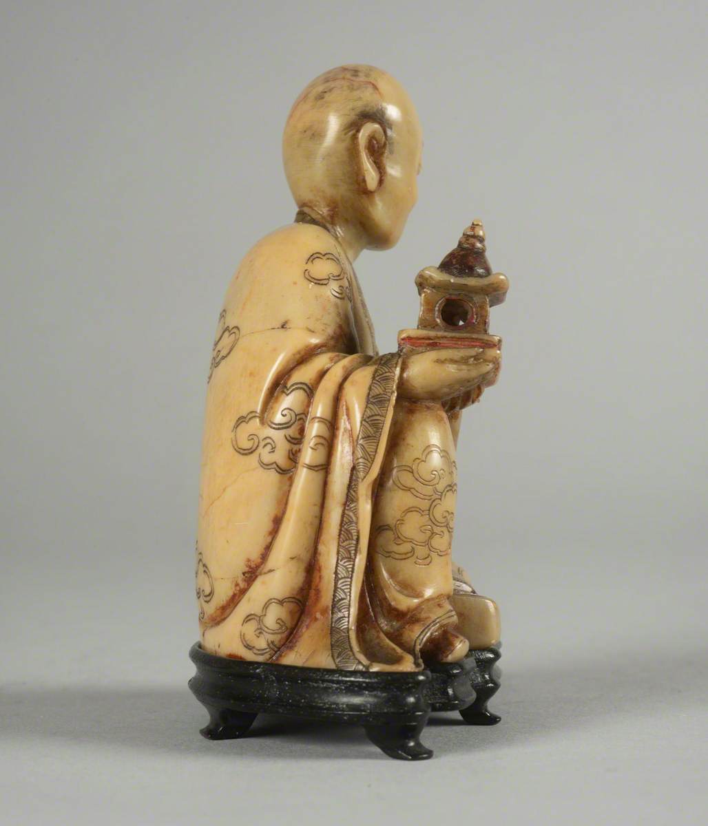 Seated Luohan (Disciple of the Buddha) Holding a Model of a Pagoda