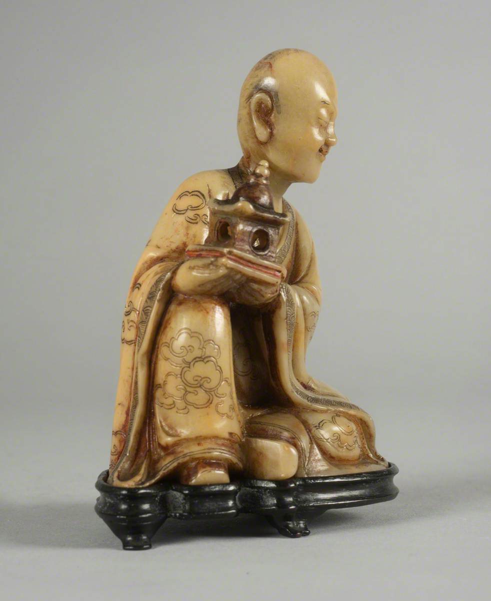 Seated Luohan (Disciple of the Buddha) Holding a Model of a Pagoda