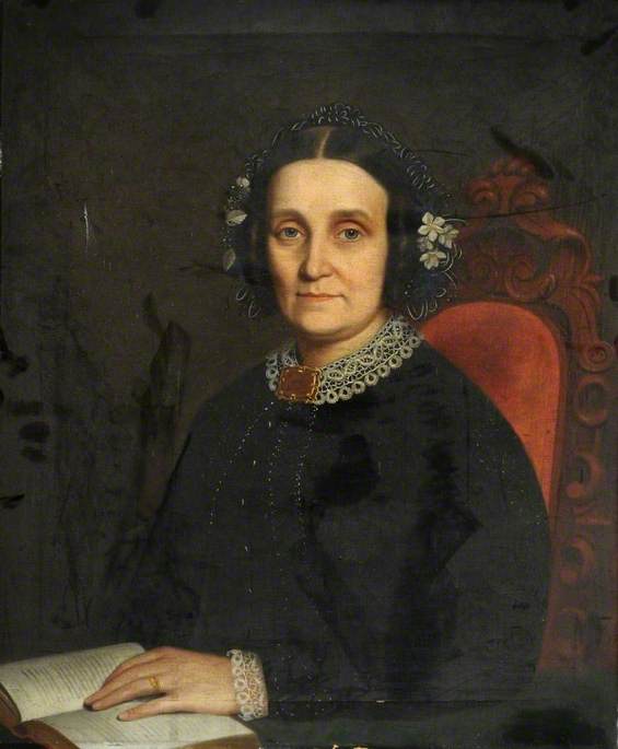 Portrait of a Lady in Black, Reading, Sitting on a Red Chair*