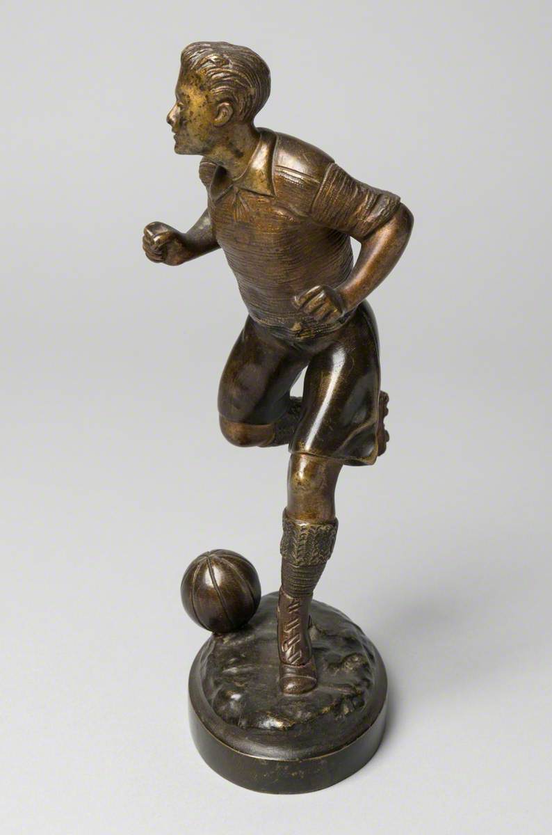 Footballer Running with the Ball