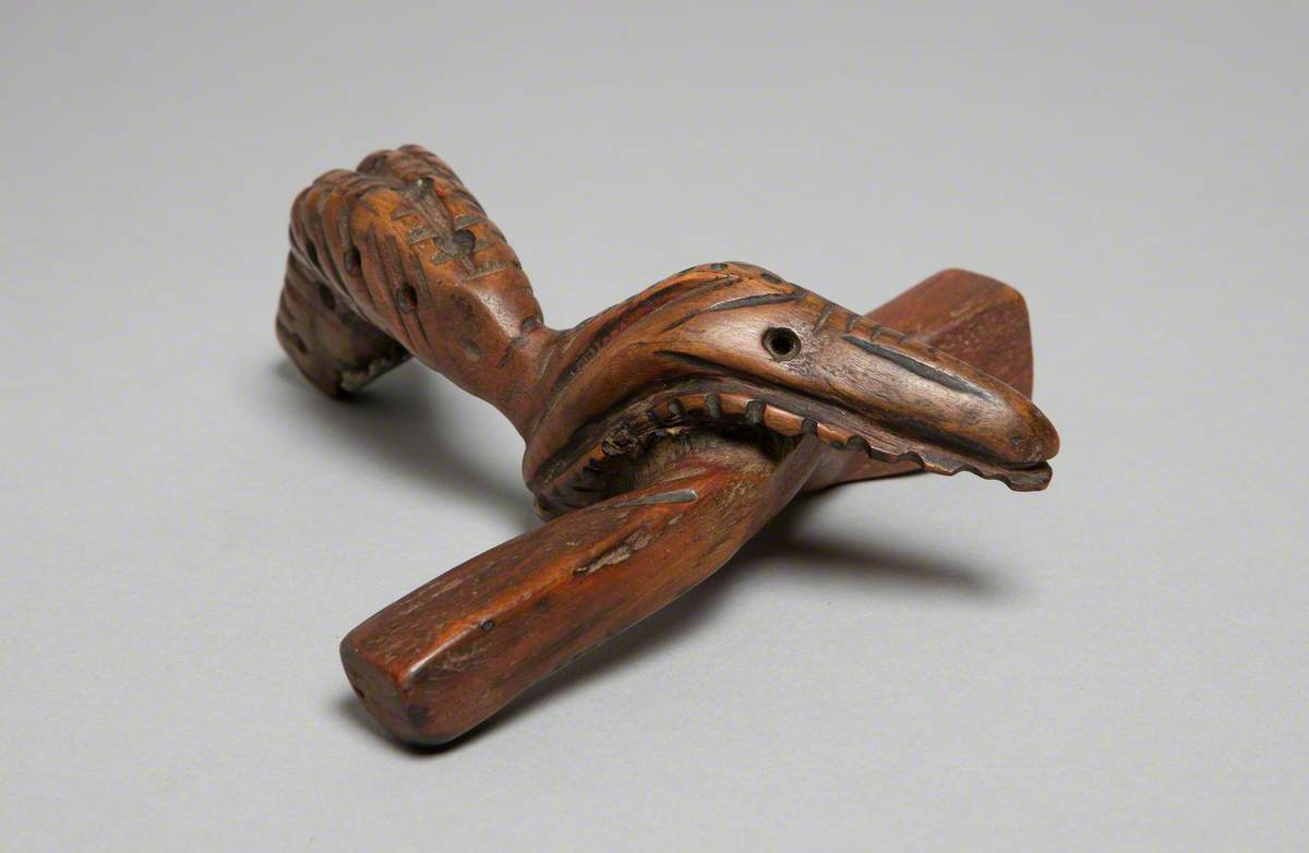 Bird Holding Piece of Wood