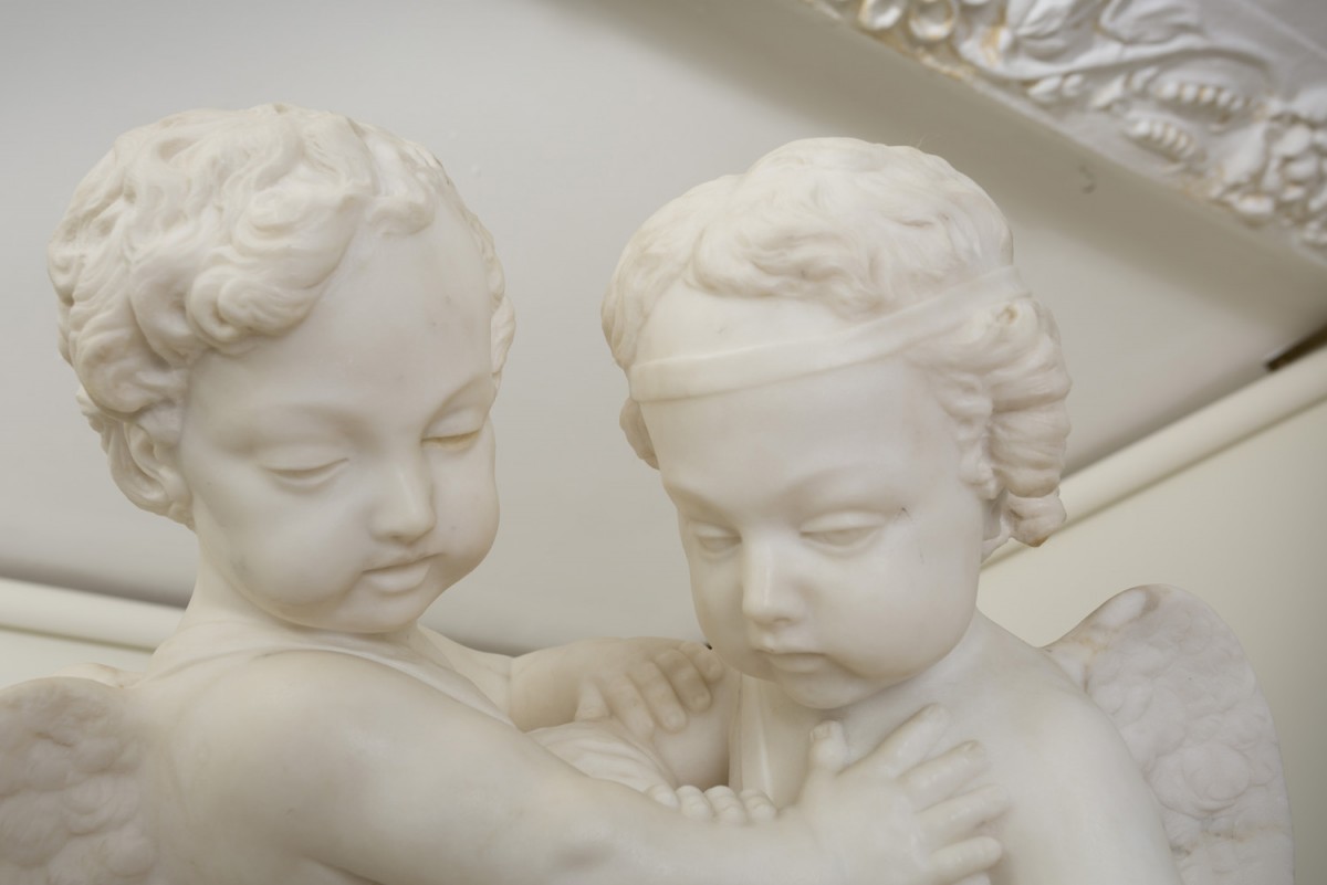 Cupids Fighting for a Human Heart