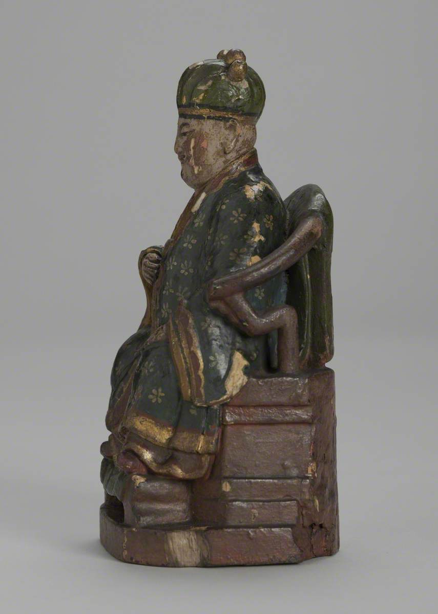 Seated Male Joss Figure