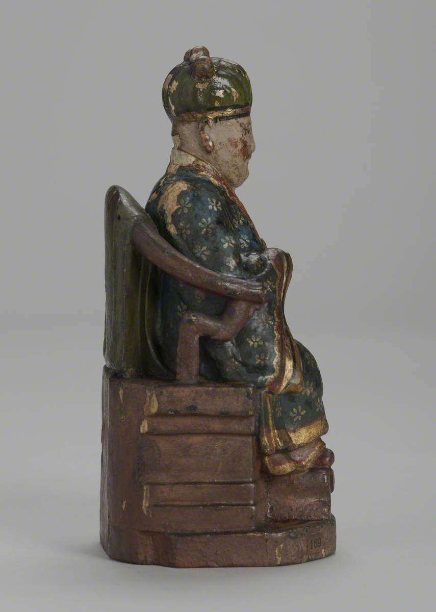 Seated Male Joss Figure