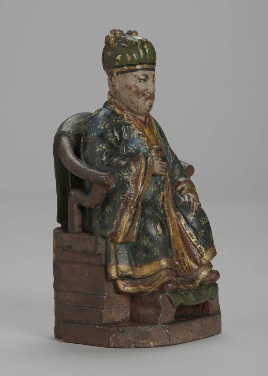 Seated Male Joss Figure