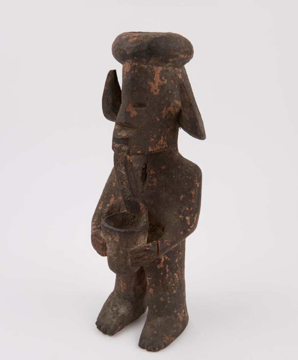 Figure with Headdress and Pipe