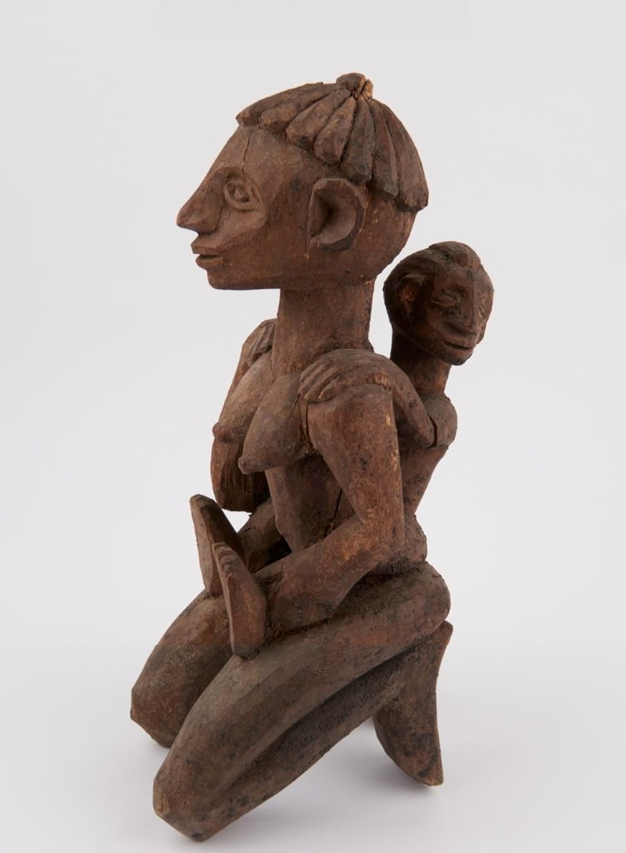 Kneeling Woman Holding Child