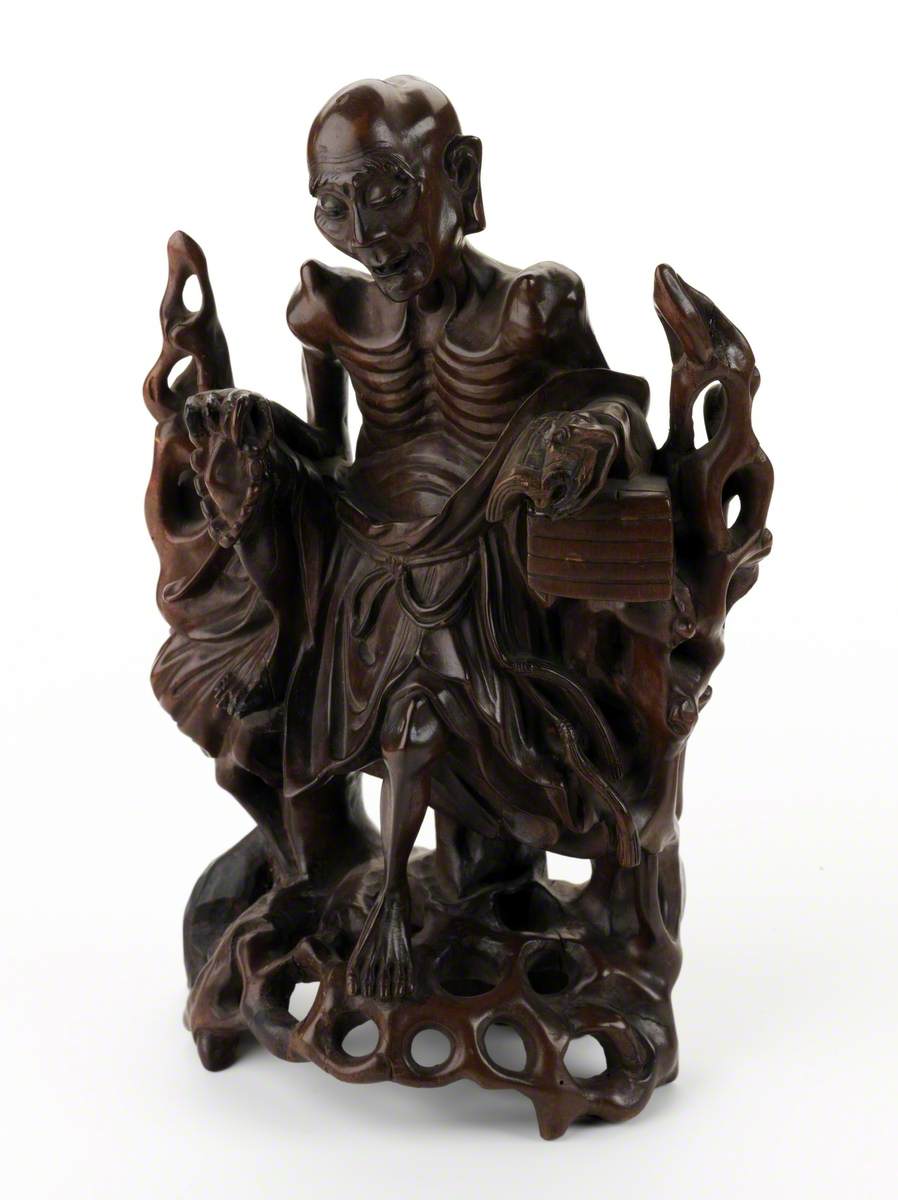 Figure of Moh Chicho reading Buddhist doctrine