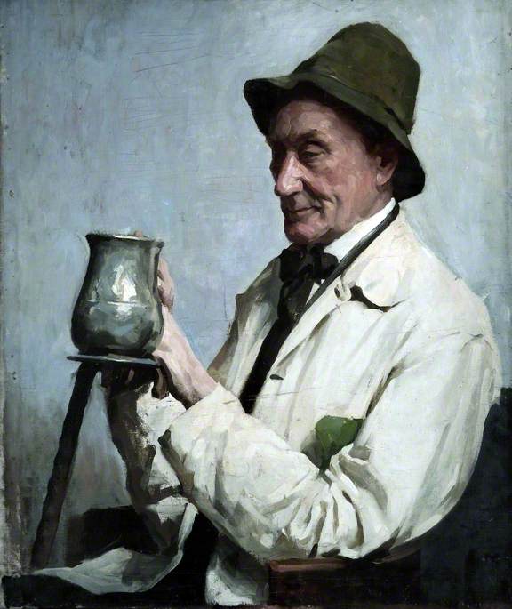 Man Wearing a Hat and Holding a Tankard