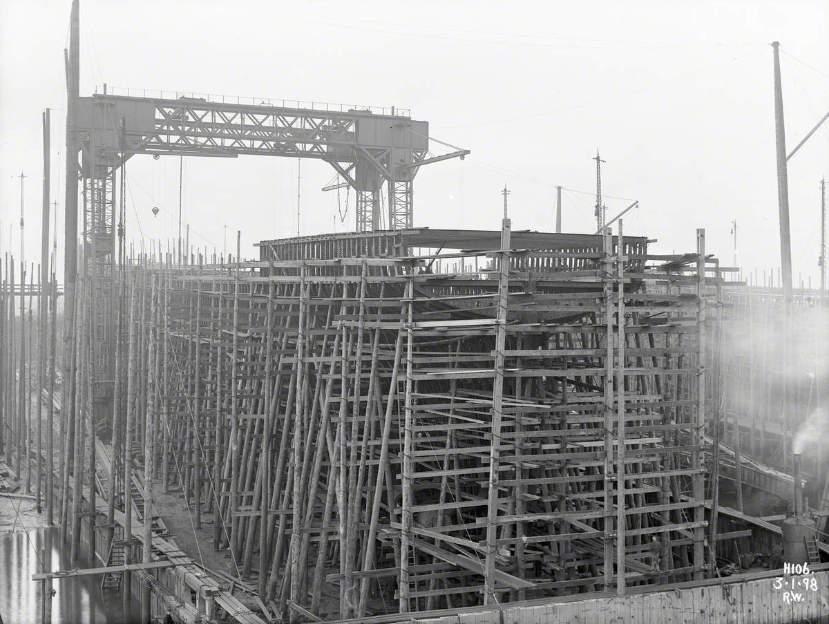 Erecting frames. Port stern view from water side of slip