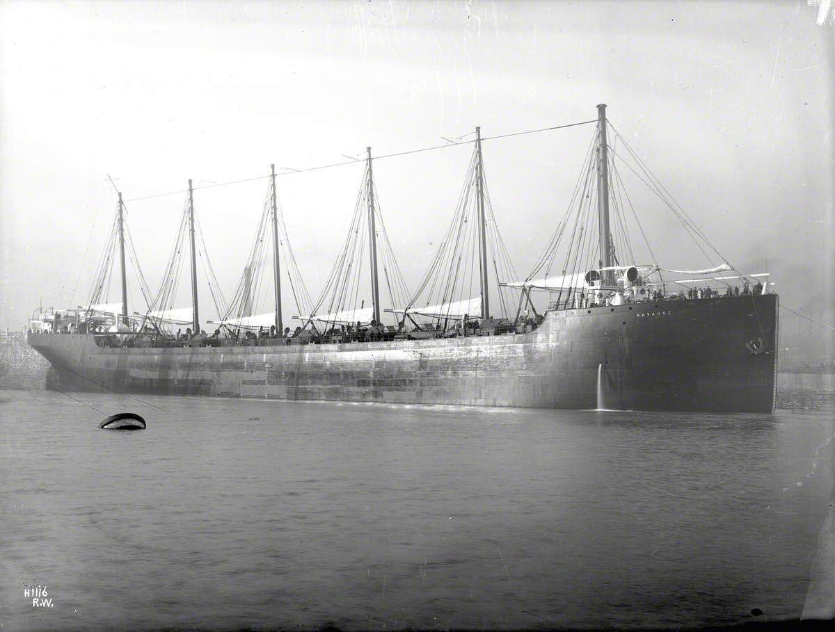 Starboard bow 3/4 profile of completed 6-masted schooner-rigged vessel, built for towing by 'Iroquois' (385)