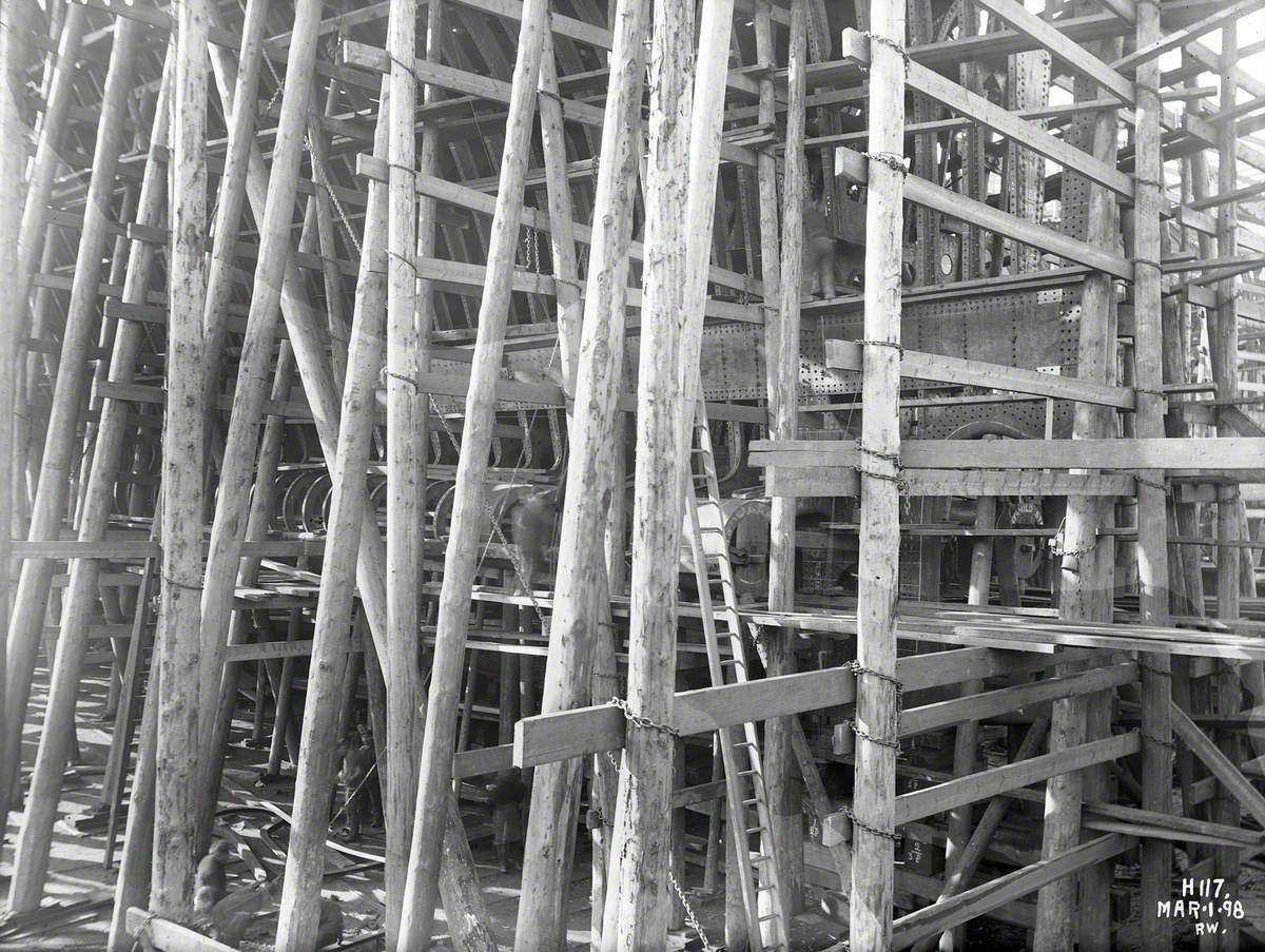 Shell plating portside hull above propeller shaft, with timber staging