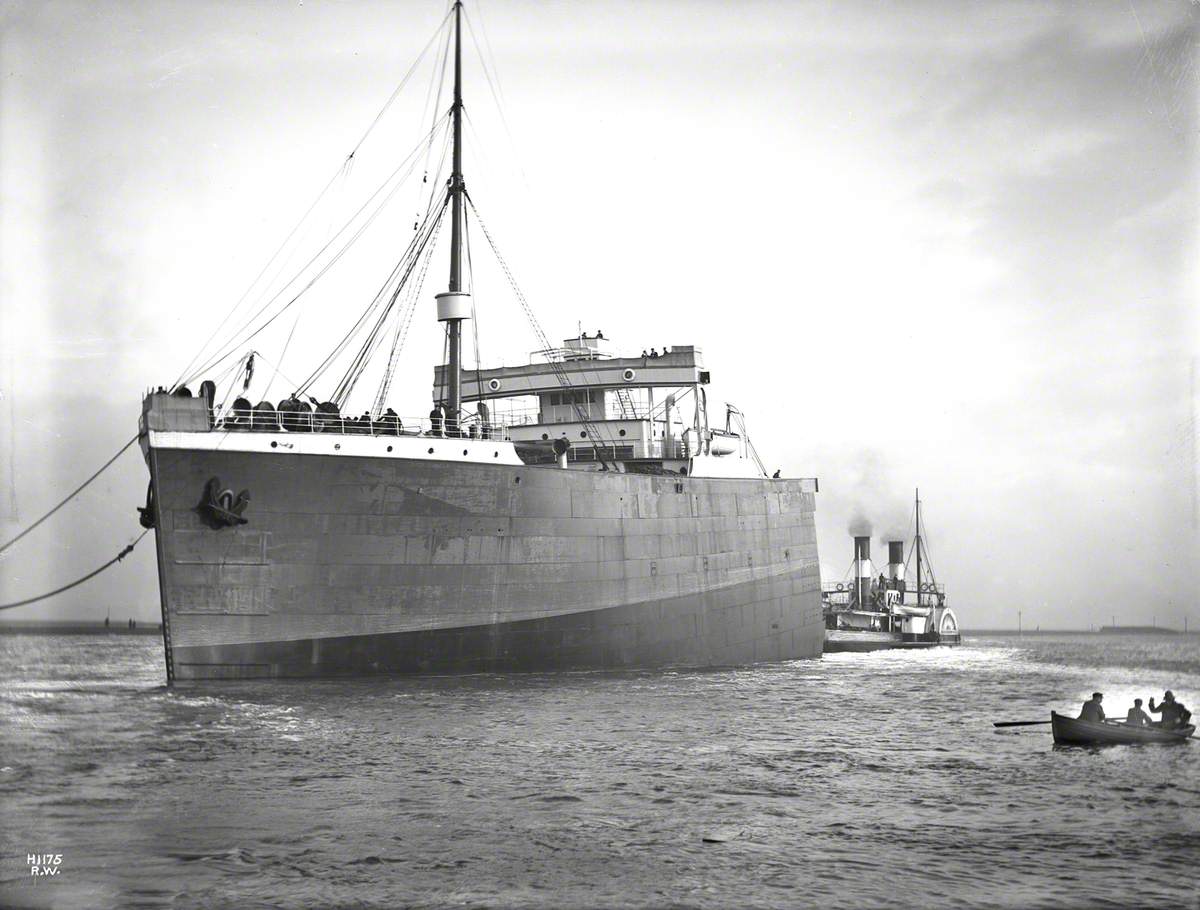 Port bow view of completed bow section under tow for Southampton