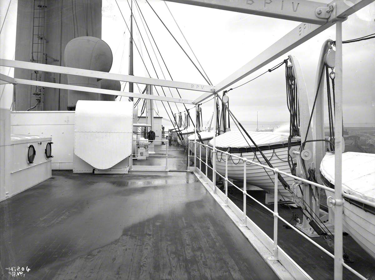 View aft from raised awning deck towards funnel and along port boat deck