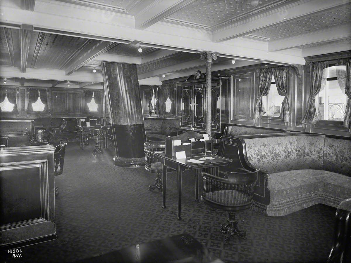 Second class library and writing room with mast passing through floor to ceiling