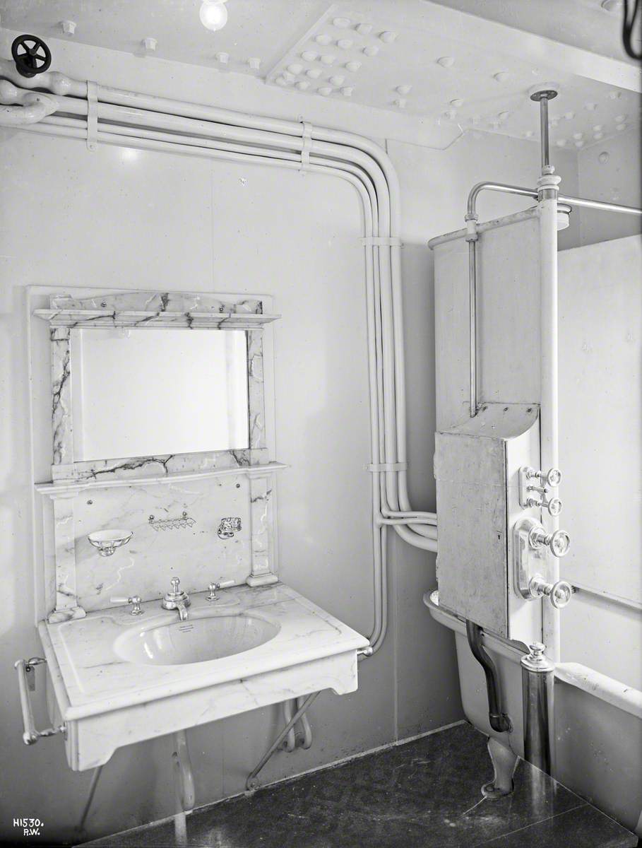 Wash basin and bath in private bathroom, probably first class