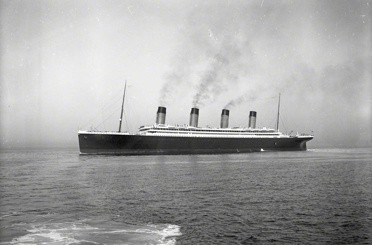 Port bow near profile of completed ship at sea, distant view