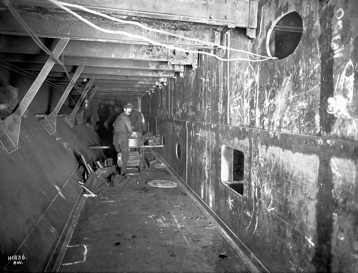 Work in progress in fitting watertight inner shell, with riveters