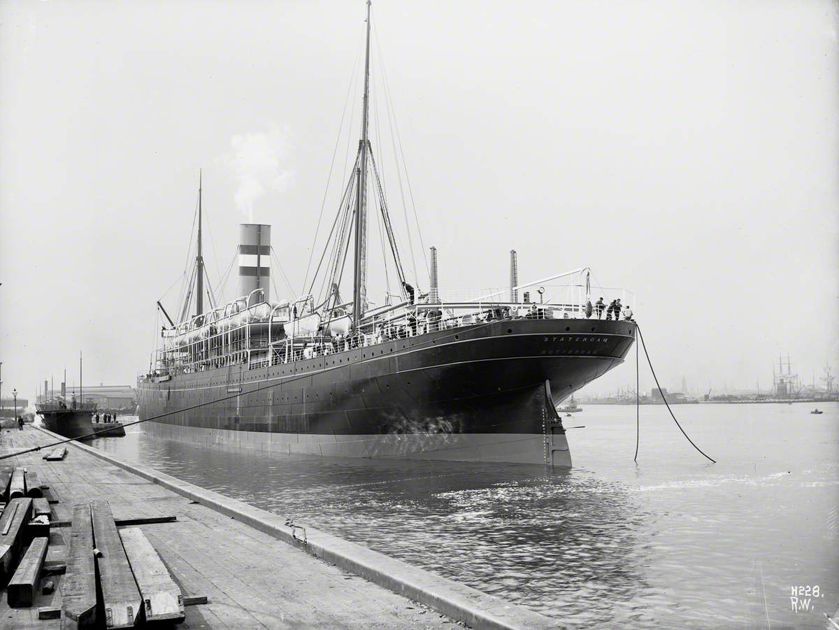Port stern view of ship being manoeuvred into Alexandra Graving Dock
