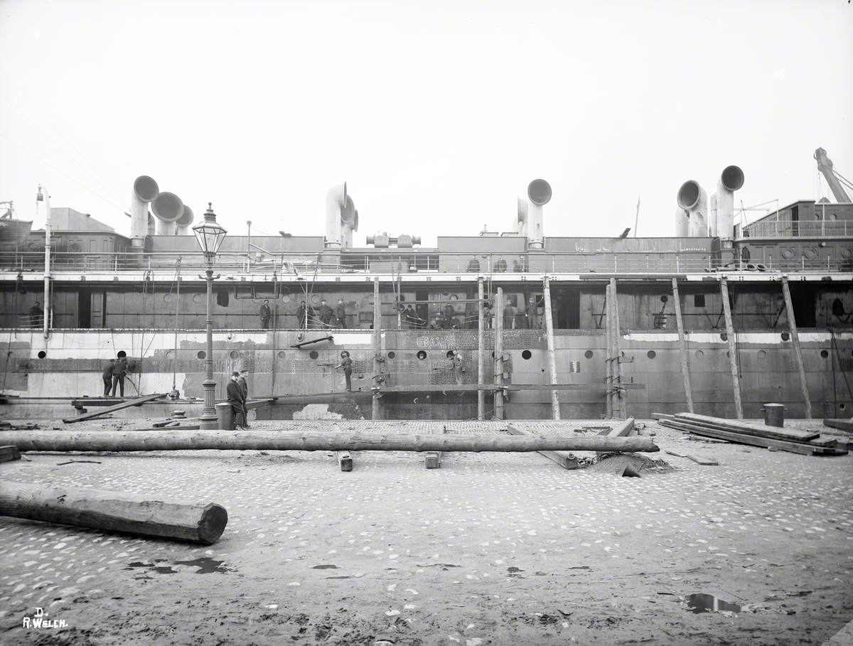 Sequence of views of ship in Alexandra Graving Dock, showing operation to lengthen hull by 54 feet