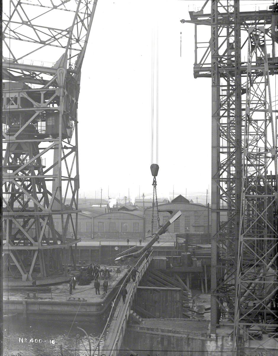 200 ton floating crane lifting part of sternframe on to slip