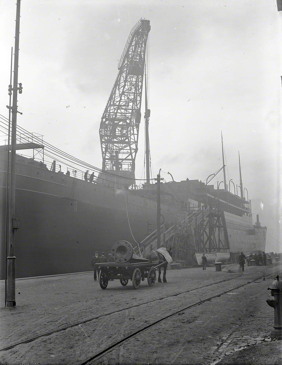 Floating crane lifting boiler and mast on board during outfitting