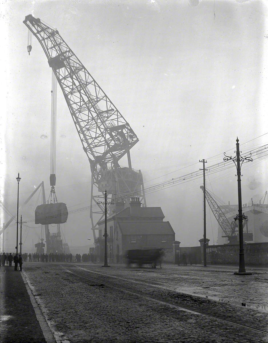 Floating crane lifting boilers on board during outfitting