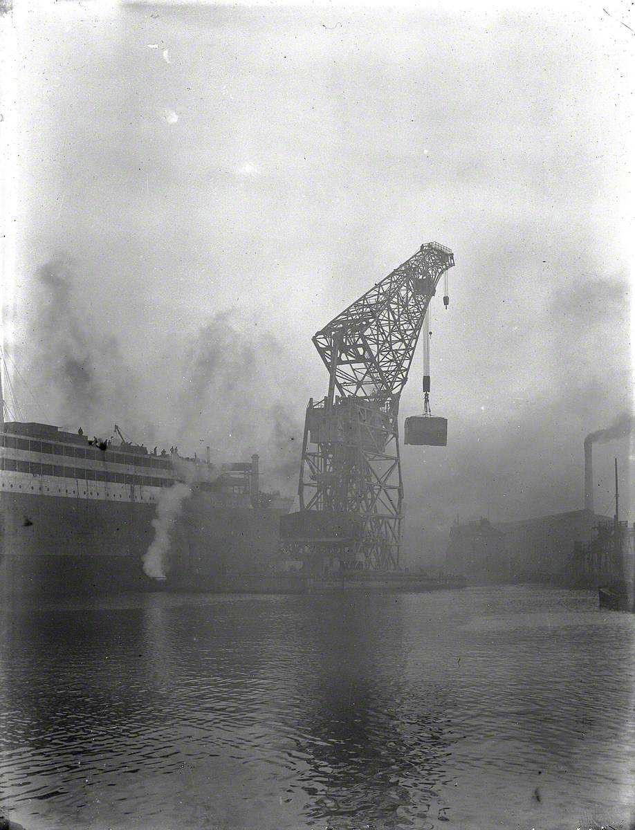 Floating crane lifting boilers on board during outfitting