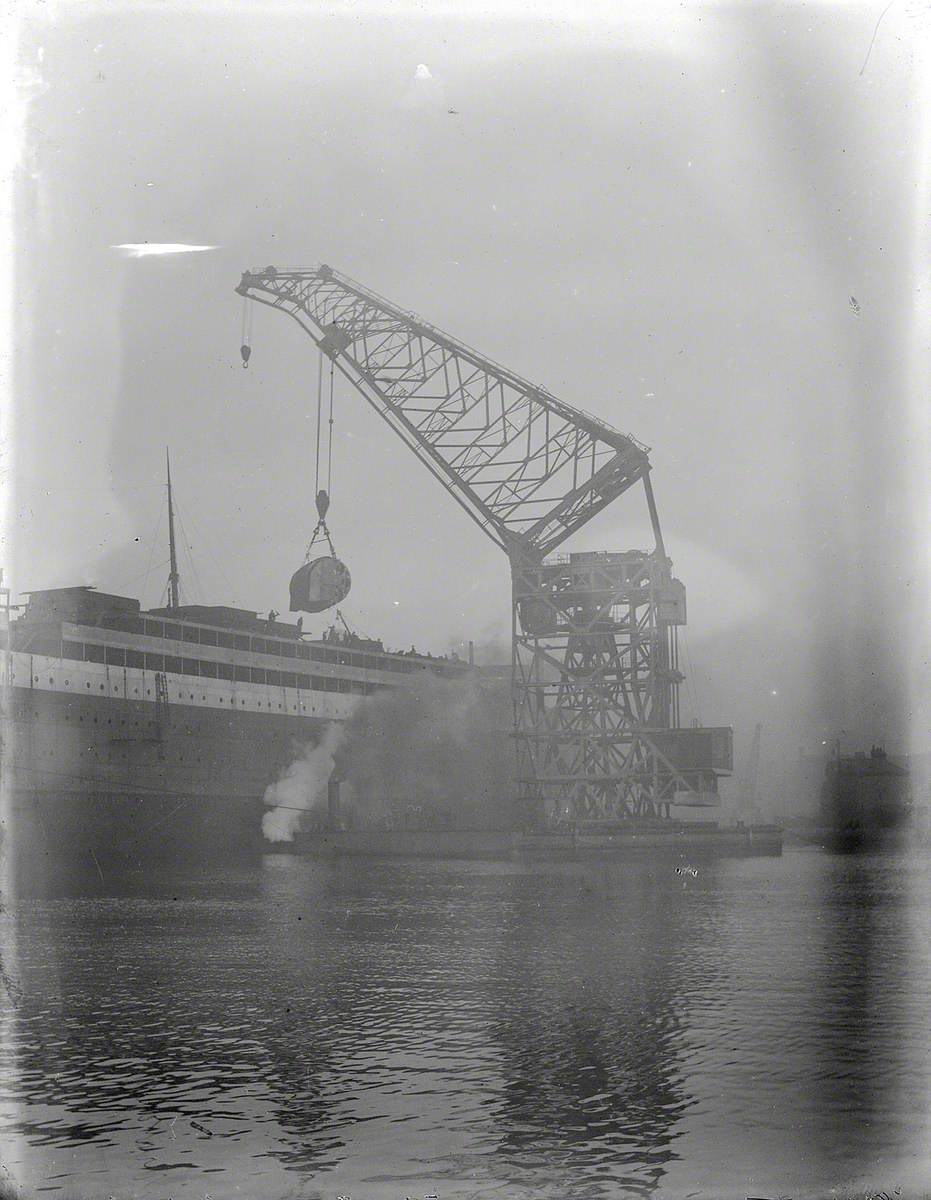 Floating crane lifting boilers on board during outfitting