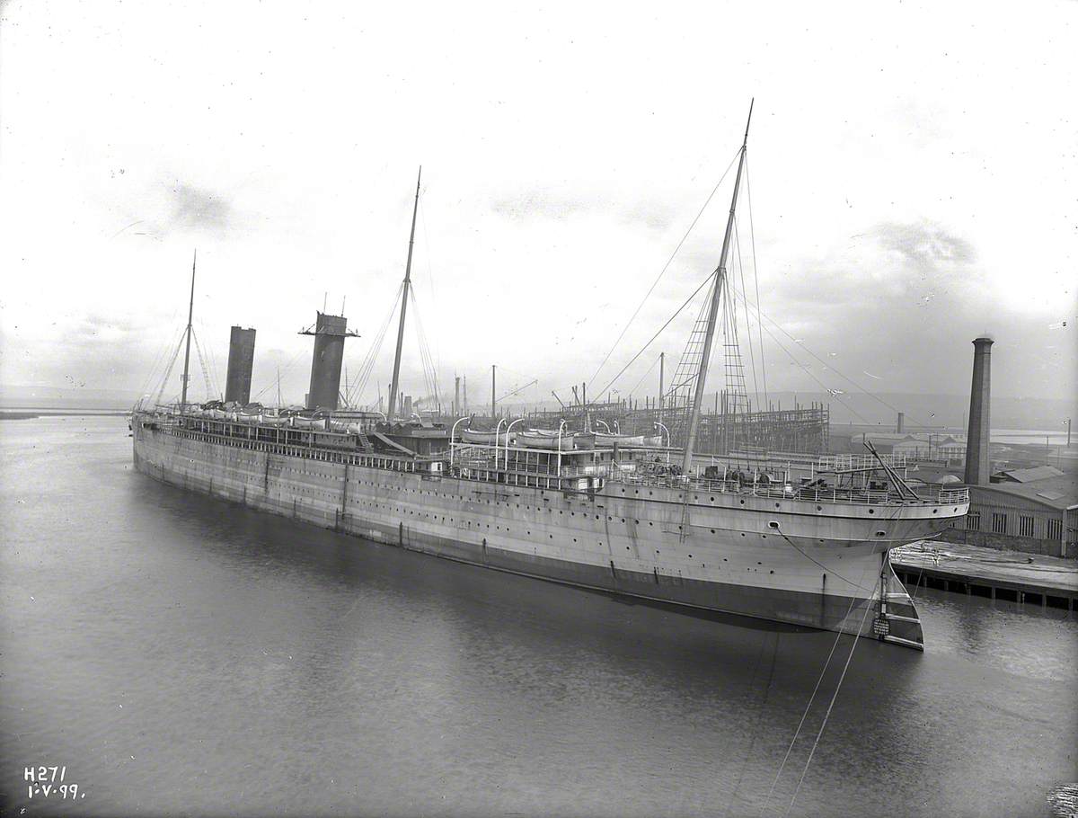 Starboard stern 3/4 profile during outfitting. Both funnels in position