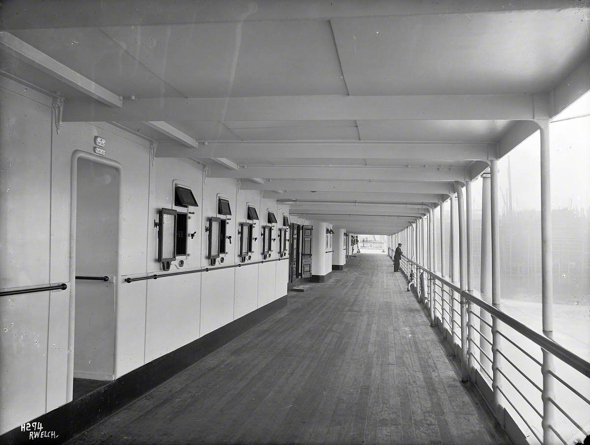 View aft along portside promenade deck