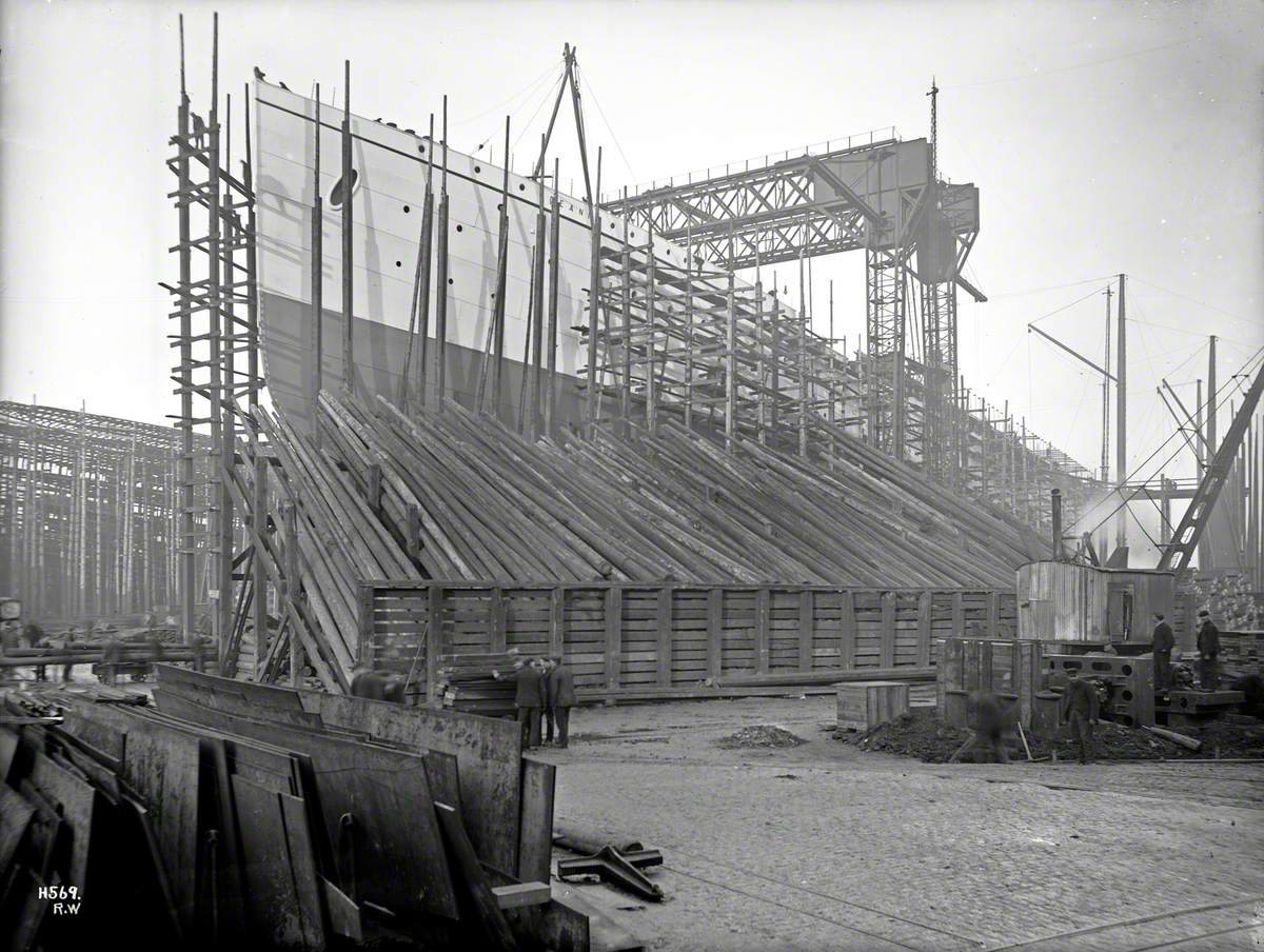Port bow view on slip prior to launch with round timber rack in foreground