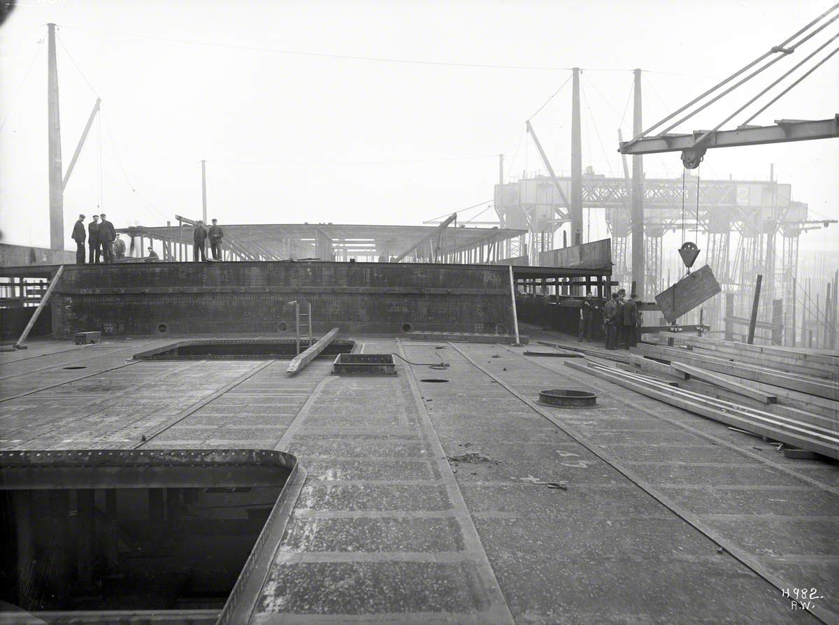 Construction of deck houses and bolting upper deck plates prior to riveting