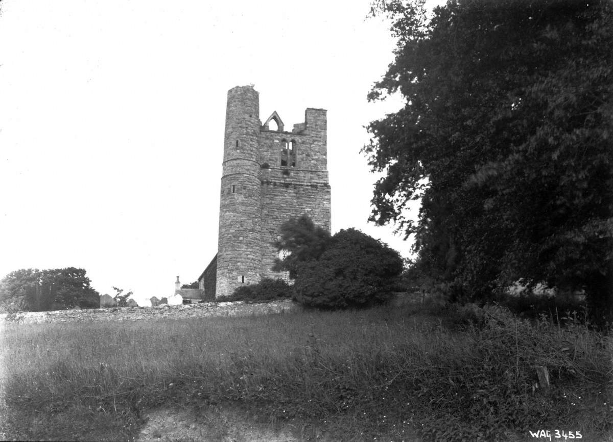 Untitled (a view of a derelict castle, round tower and graveyard)