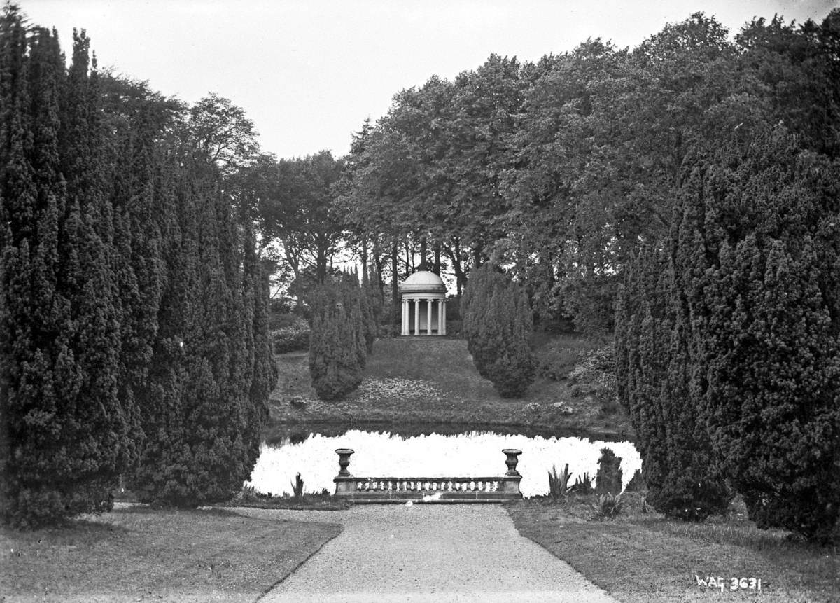 Untitled (a front view of a temple over water in a large garden that is Lake Temple, Hillsborough Castle)