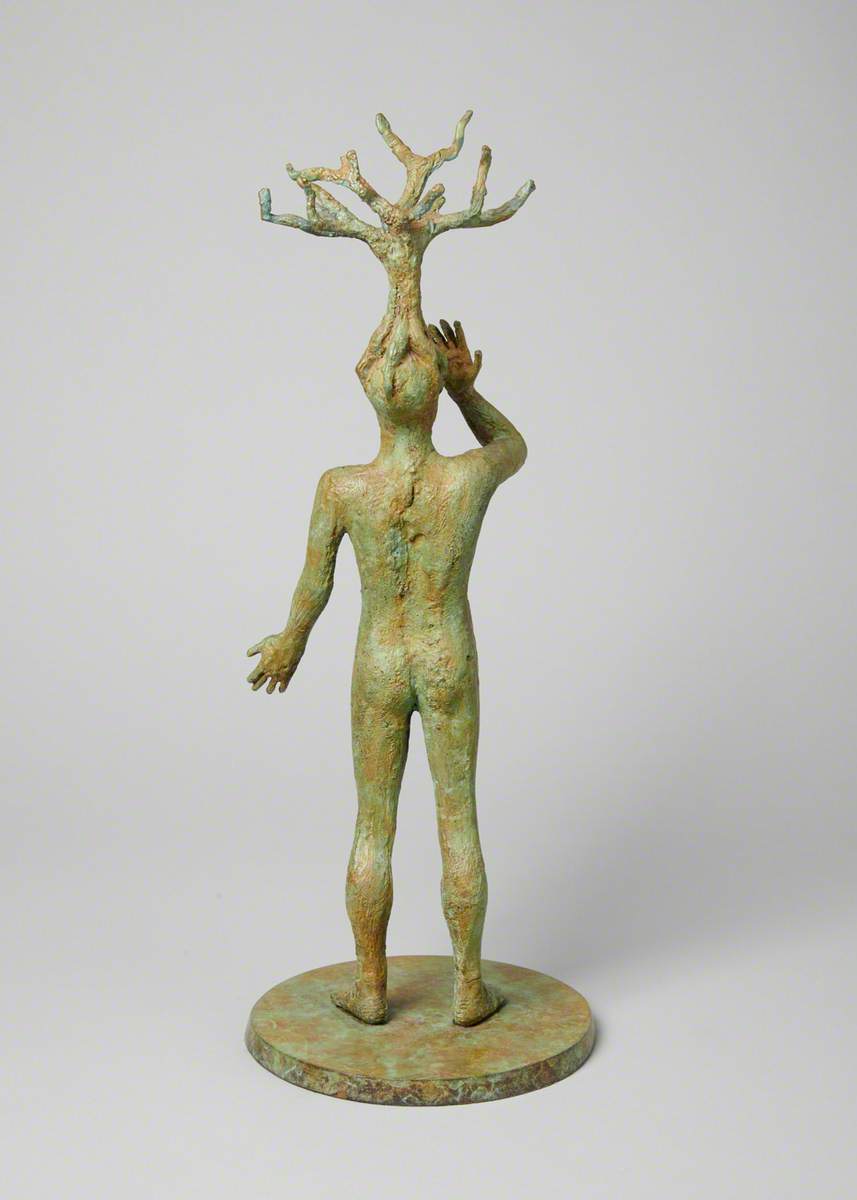 Figure with Tree on Head
