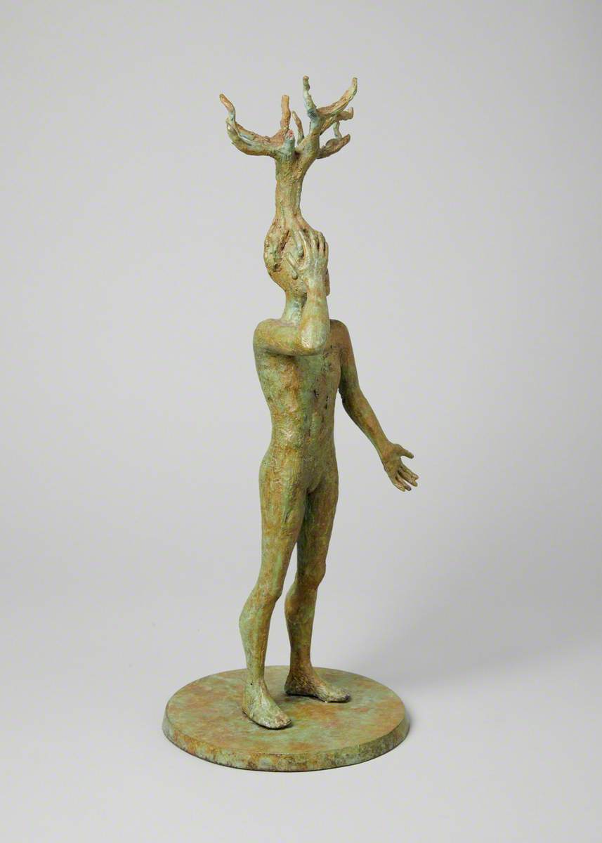 Figure with Tree on Head