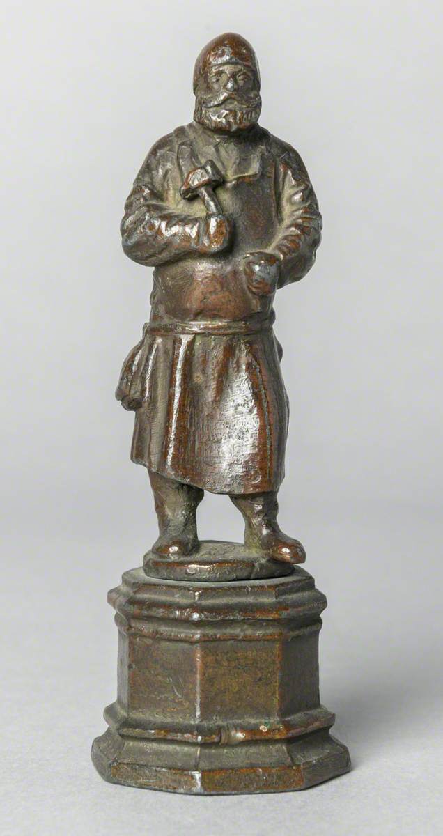 Figure with Hammer (possibly a blacksmith)