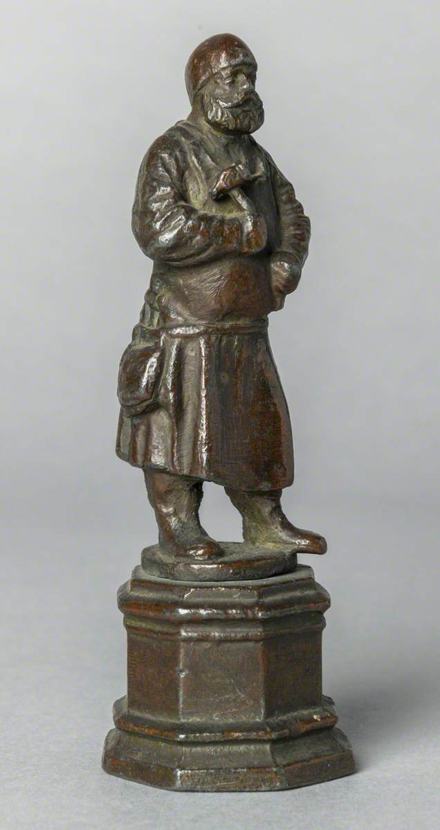 Figure with Hammer (possibly a blacksmith)