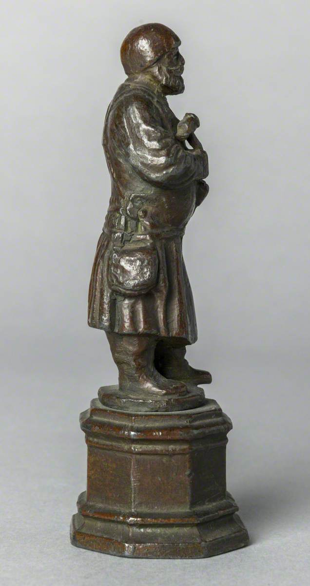 Figure with Hammer (possibly a blacksmith)