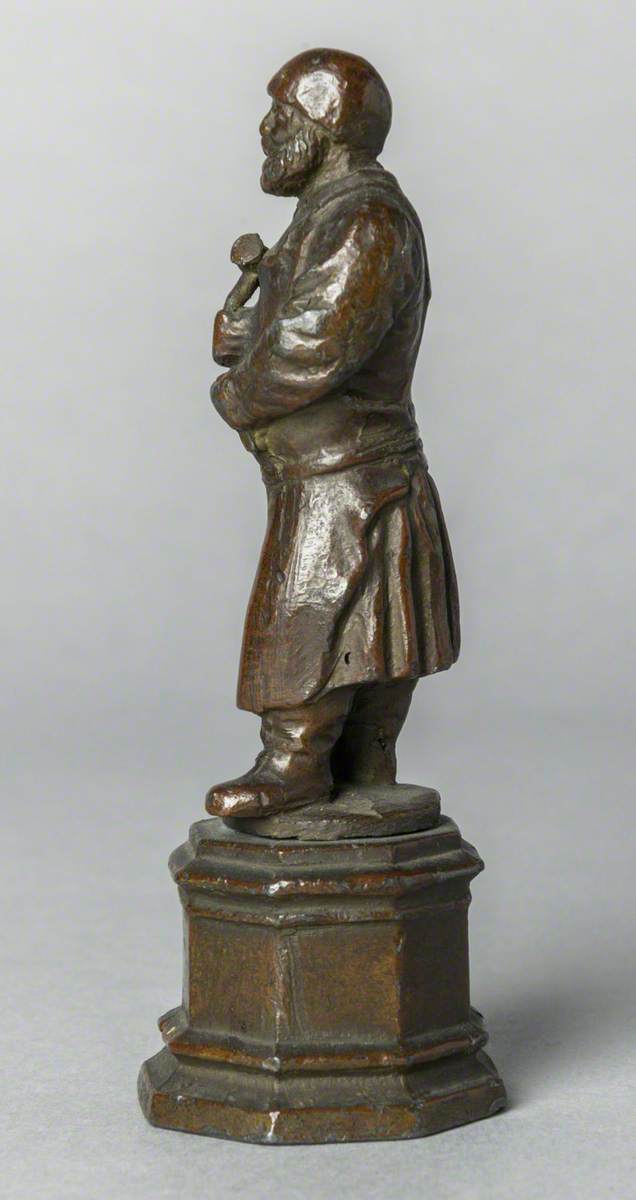 Figure with Hammer (possibly a blacksmith)
