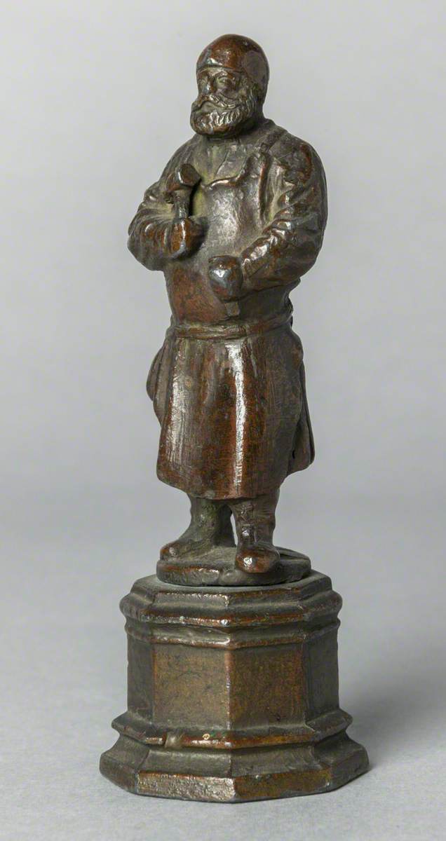 Figure with Hammer (possibly a blacksmith)