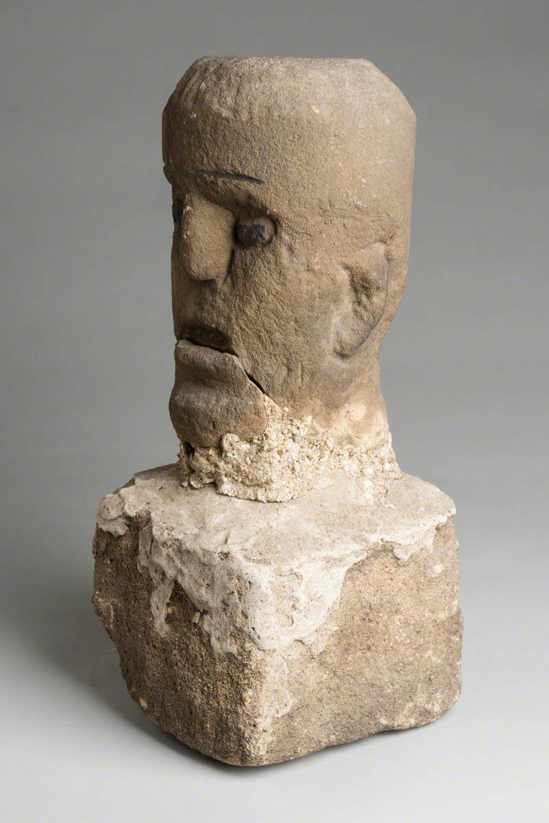 Carved Stone Head with Stone Plinth