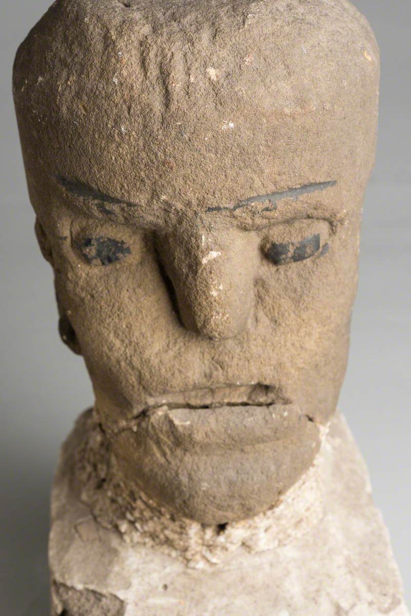 Carved Stone Head with Stone Plinth