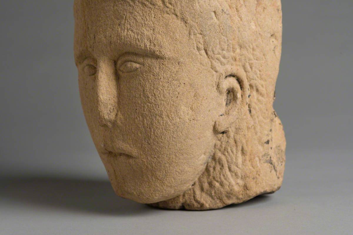 Sandstone Head with Carved Face
