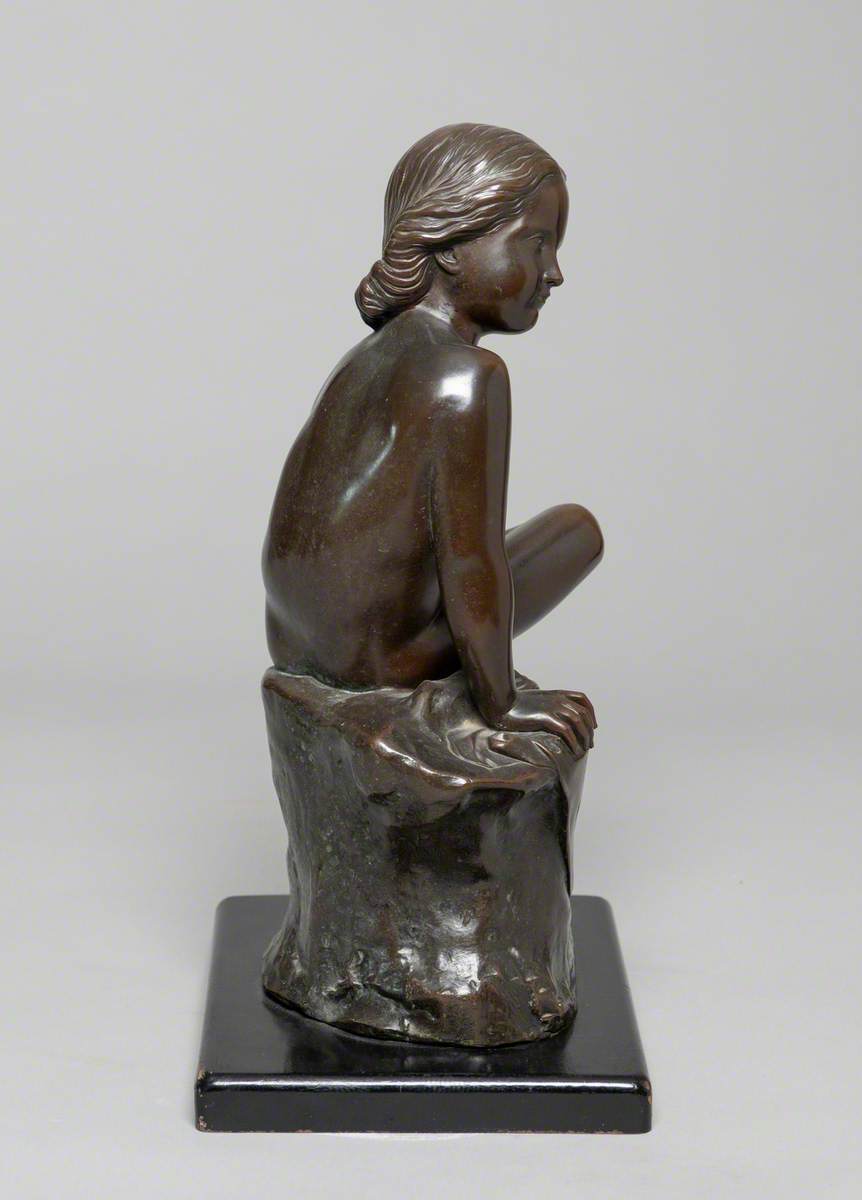 Child Seated on a Rock