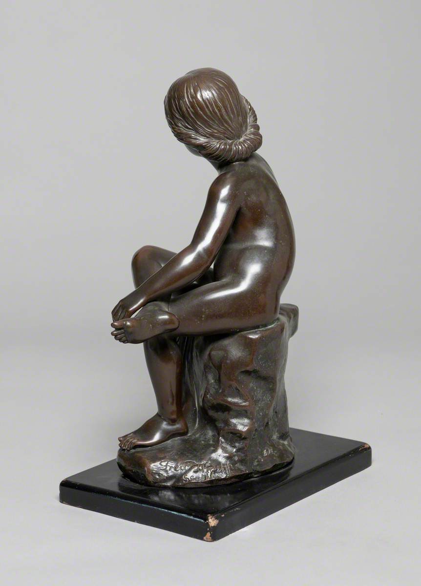 Child Seated on a Rock