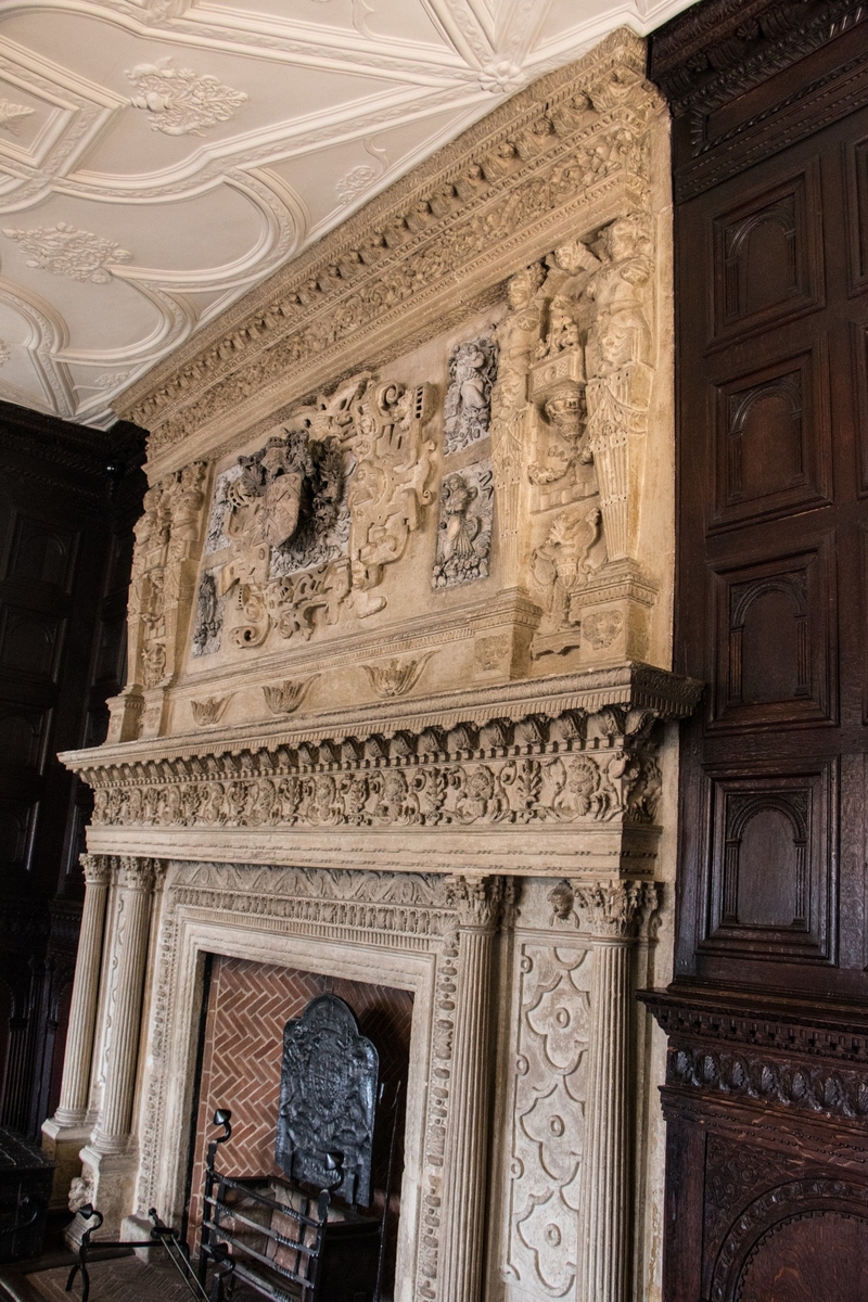 Carved Fire Surrounds and Wooden Wall Cladding